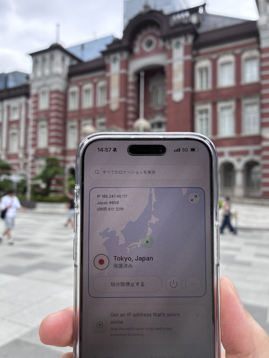 Checking the NordVPN connection status on an iPhone near Tokyo Station